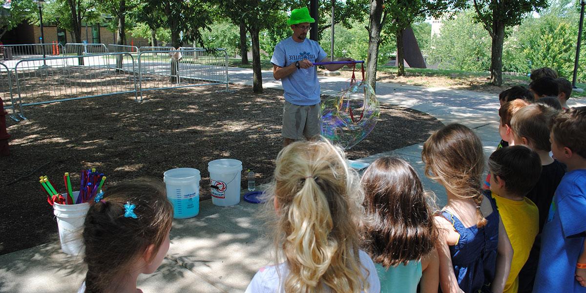 Kids watching presentation on bubbles.